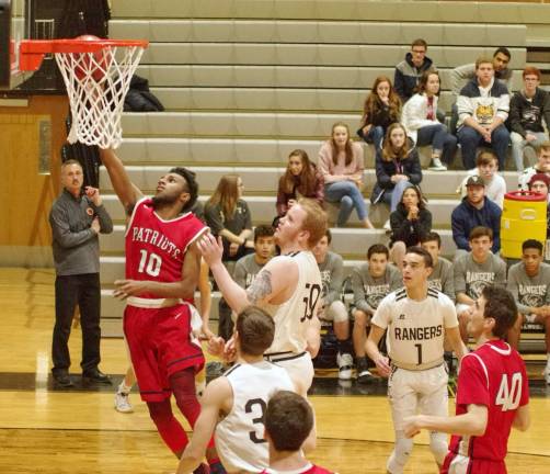 Lenape Valley's Nasir Dickerson raises the ball towards the hoop in the first quarter. Dickerson scored 10 points.