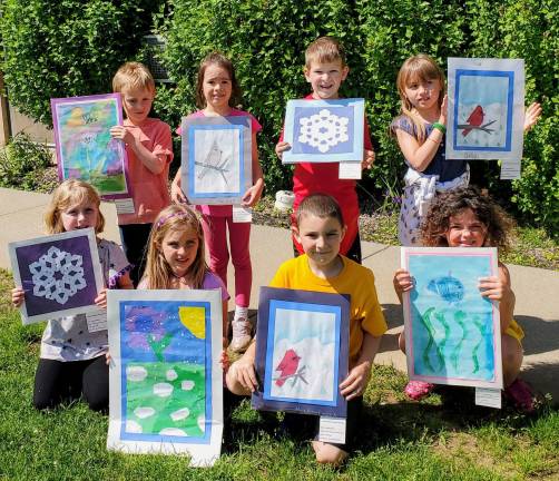 Throughout the school year, art students from Cedar Mountain Primary School in Vernon created work reflecting the beauty of nature in their hometown under the direction of Mrs. Denise Docherty. Examples of these masterpieces were on display at Heaven Hill Farm at EarthFest. Pictured are Charlotte, Delilah, Filip, Johnny, Kat, Kyra, Michael, and Seong-Jin proudly holding their artwork.