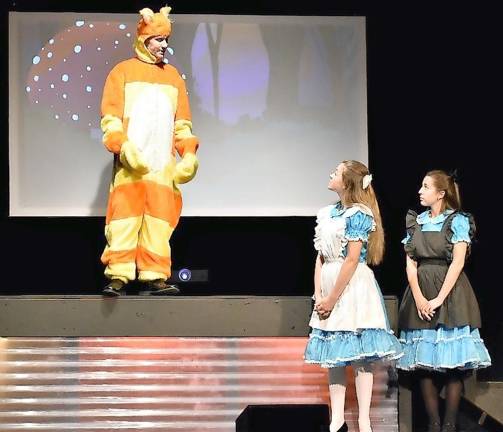 Whacky characters abound in Kittatinny Players’ ‘Alice in Wonderland’ Colin Webb played the Cheshire Cat who befriends Alice throughout her journey. Katie Williver gave a perfect performance as Alice. (Photo provided)