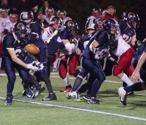 Jefferson's Brandon Magnotta momentarily bobbles the ball after taking a handoff by quarterback Anthony (Cheech) Johnson.