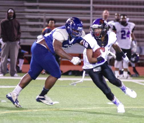 After a reception in the second half Nassau Punishers wide receiver Taymar Whitehurst avoids the grasp of Sussex Stags defender Isaiah Sommerville.