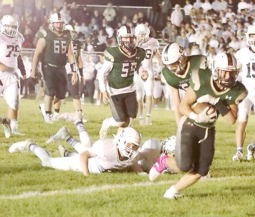 Sussex Tech ball carrier Bo Maroney eludes Wallkill Valley defenders in the second half. Maroney rushed for two touchdowns.