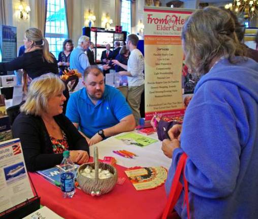 Linda Esposito and her son John of From the Heart Elder Care are shown at their exhibit during the Sussex County Chamber of Commerce's 22nd Annual Business Expo. After years in Vernon, they recently left the township to re-establish their business in Sussex Borough.