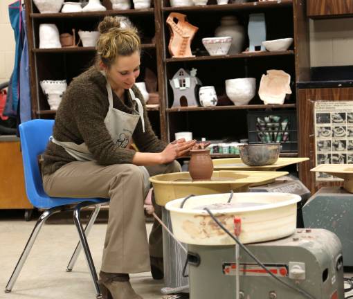 High Point holds open house Kelly Kuzicki, one of four fine art teachers at High Point demonstrates the potters wheel at the open house.