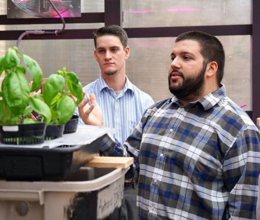 High Point opens new greenhouse From left, teachers Paul Cardinal and Alexander Gonzalez interact with students.