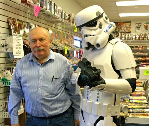 Everybody wanted to pose with the stormtrooper including Bob&#xfe;&#xc4;&#xf4;s Collectables owner Bob Adams. Stormtrooper TK-41066 was none other than Chris Manning of Vernon, a member of Northeast Remnant, 501st Legion.