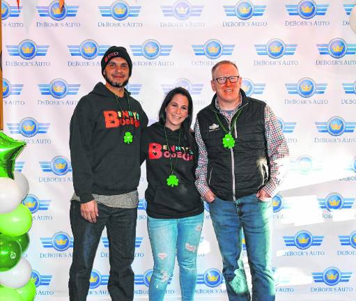 Benjamin and Heather Davey, founders of Benny’s Bodega in Newton, pose with Bill DeBoer, co-owner of DeBoer’s Auto in Hamburg. (Photos by Maria Kovic)