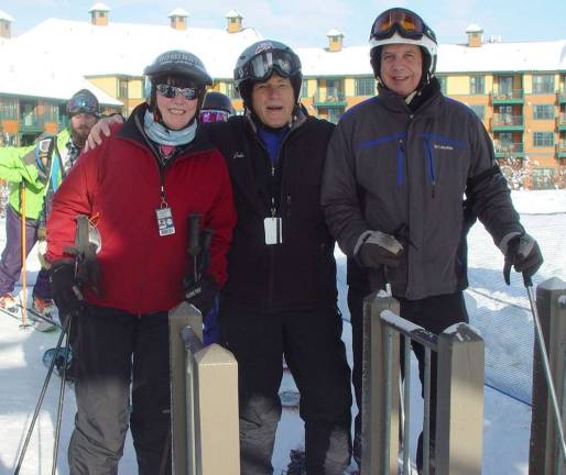 Vernon residents Buffy Whiting, John Whiting await the first chair of the 2014-15 ski season with friend John Hoffman from Sparta.