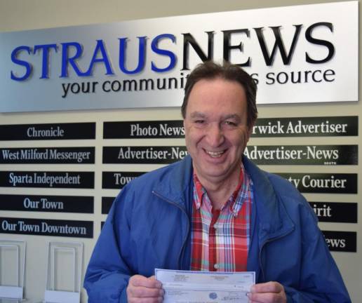 Warwick resident John Chardavoyne collecting his $250 check