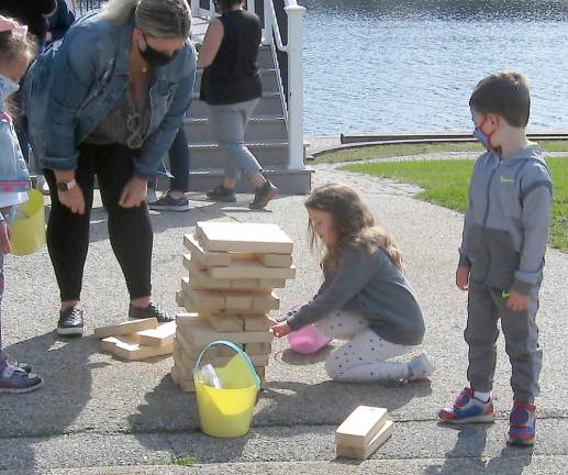 Jenga kept the under eight crowd amused. A grab and go craft was provided to enjoy at home. (Photo by Janet Redyke)