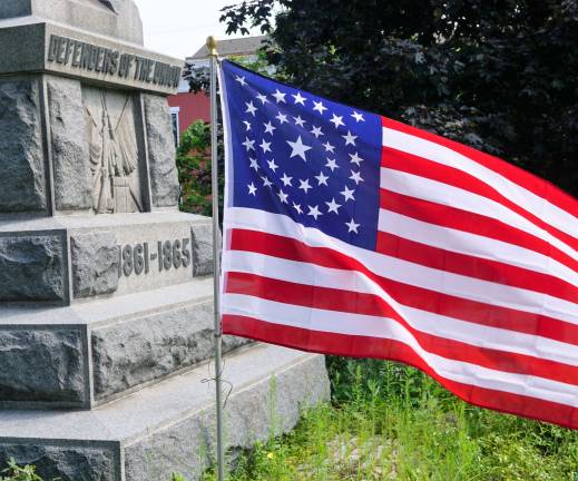 The Civil War era flag flies during the rededication of the &quot;Defenders of the Union&quot; Monument.