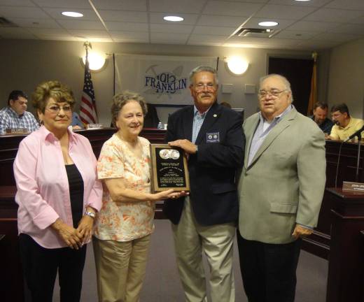 Photo by Scott Baker The Knights of Columbus Marquette Council presented Franklin resident Sally McGrath with their annual Senior of the Year award at Tuesday night's Borough Council meeting. &quot;Sally has been a true asset to her community,&quot; said Marquette Council community director Stephen Marino. He even hinted that her connection to Franklin High School went well beyond her long career. &quot;It has been said that she planted the oak tree on the hilltop which is Franklin High School's alma mater song,&quot; he joked. McGrath is active with the Daughters of the American Revolution, Franklin Historical Society and helping area senior citizens. Pictured, from left are: Emily Basilwich, Sally McGrath, Stephen Marino and Franklin Mayor Paul Crowley.