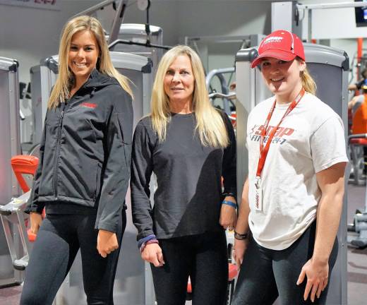 From left, Danielle Osellame, Shari McAtee, and Caity Hennessy stand in the new Vernon Snap Fitness location.
