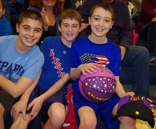 Harlem Wizards dazzle locals on the court Eleven year olds and Sparta residents Mike McGovern, A.J. Davis and Nick Capeci enjoy the Harlem Wizards performance.