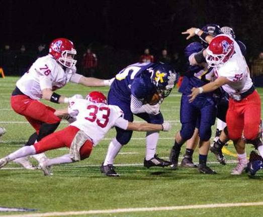 Lenape Valley defenders close in on a Jefferson ball carrier.