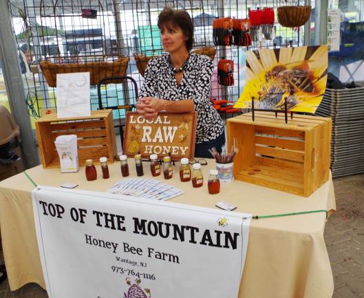 A taste of honey awaits at the Top of the Mountain Honey Bee Farm table.