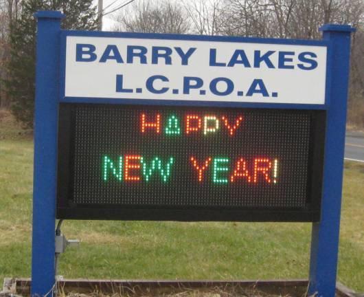 PHOTO BY JANET REDYKEThe digital sign outside the Barry Lakes Clubhouse wishes a Happy New Year to all.