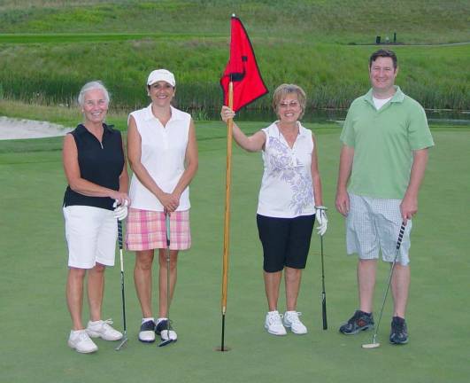 Crystal Springs hosts 9 n Dine tourney Team of Anita Jennings, Shirley Paulino, Judy Mett & George Henderson on the par 3 6th hole at Ballyowen.