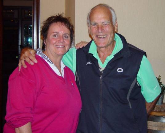Carolyn Russo accepts her long drive prize from John Whiting
