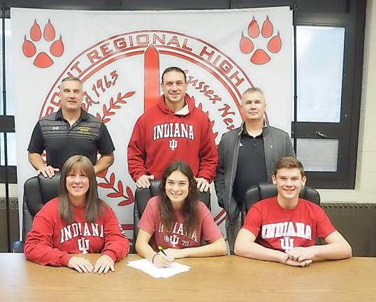 High Point's Zoe Tiger, seated middle, signs her National Letter of Intent to continue her soccer career at Indiana University next fall. Pictured are seated from left to right - mother Cindy, Zoe, and brother Troy. Standing from left to right are Director of Athletics/Assistant Principal Todd Van Orden, father Jahn, and Head Girls' Soccer Coach Kevin Fenlon.