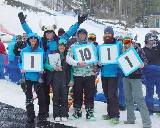 Mountain Creek ends ski season with splash Mountain Creek Staffers score the participants in the Pond Skimming competition