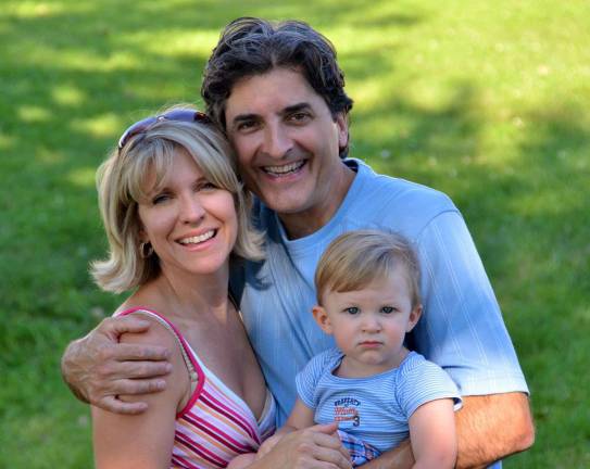 An early family photo of MS patient Faith Anderson, her husband, Jon Hartlage, and their son, Darios James Hartlage, soon after he was born six years ago and around the time Anderson began experiencing the symptoms of her affliction