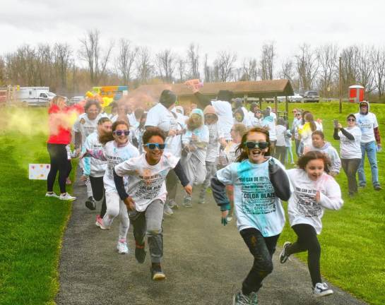 Children begin the PTA Color Run on Saturday, April 13 at Hamburg Park. (Photo by Maria Kovic)