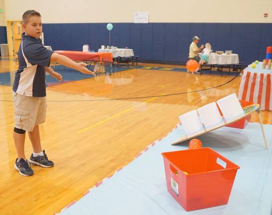 A young man plays one of the games