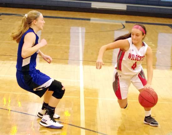 High Point's Morgan Smolen dribbles the ball in the first quarter. Smolen scored 3 point and grabbed 2 rebounds.