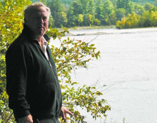 Whitewater park may be coming to the Delaware River Committee member Fred Merusi shows where the Whitewater Park would be, ending with the rocks. (Photo by Anya Tikka)