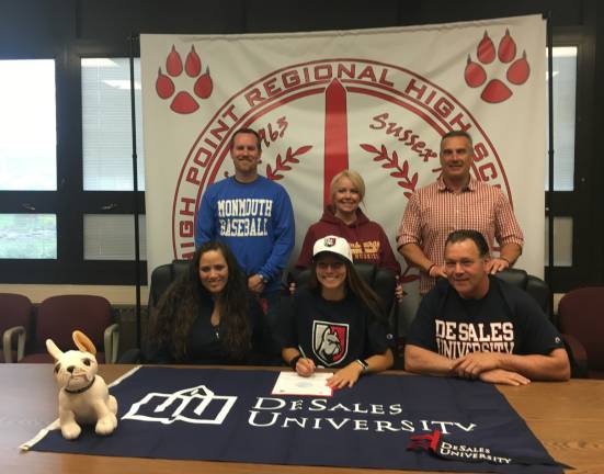 High Point's Tyra Wingle, seated middle, will continue her field hockey career next year at DeSales University. Seated from left to right are mother Mona, Tyra, and father Rich. Standing from left to right are Principal Jon Tallamy, Head Field Hockey Coach Kelly Reynolds, and Assistant Principal/Athletic Director Todd Van Orden.