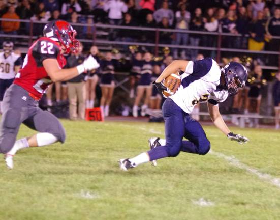 Jefferson wide receiver Andrew Benfatti stumbles towards the ground after catching the ball in the second quarter.