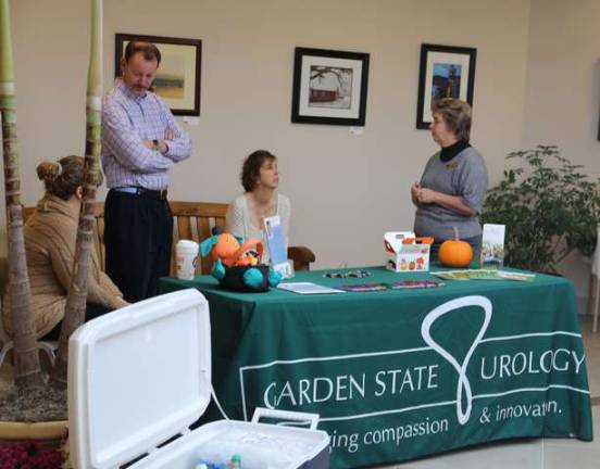 Representatives of Garden State Urology present information to visitors at Franklin-fest.