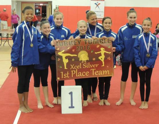 Lily Kucks, Kate Sutphen, Ava Dutor, Kacy Biddiscome, Melissa Towey, Karen Maasbach, all of Sparta, Danielle Bruce of Vernon and Emily Harms of Sparta were the first-place Xcel Silver team at the turkey tumble.