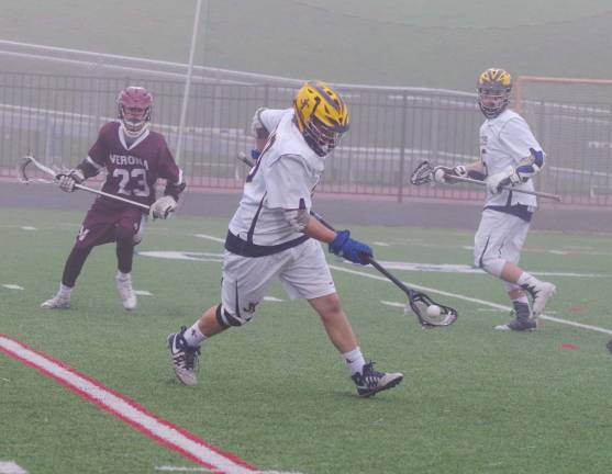 Jefferson's Paul Letizia scoops up the ball. Letiza picked up two ground balls.