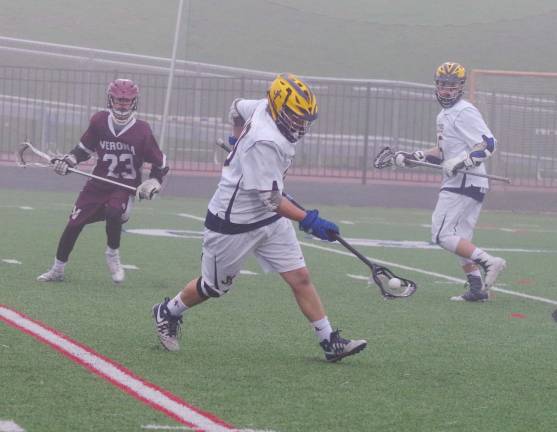 Jefferson tops Verona in lacrosse Jefferson's Paul Letizia scoops up the ball. Letiza picked up two ground balls.