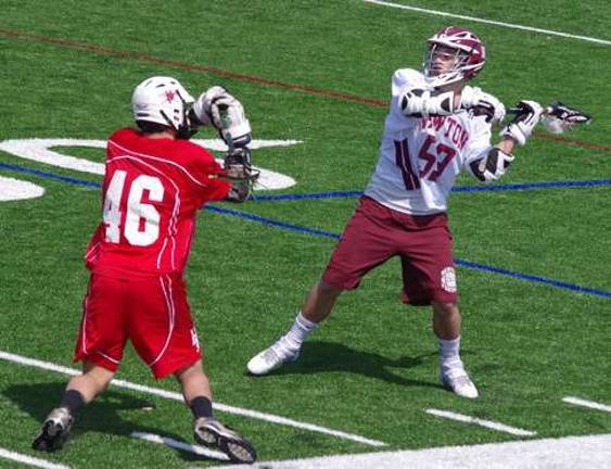 High Point's Alex Blundetto (46) defends against Newton's Zach Martin (53).