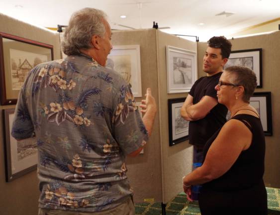 Bruce Young, left, was one of the 17 artists exhibiting in the Highland Lakes&#xfe;&#xc4;&#xf4; 57th consecutive art show.