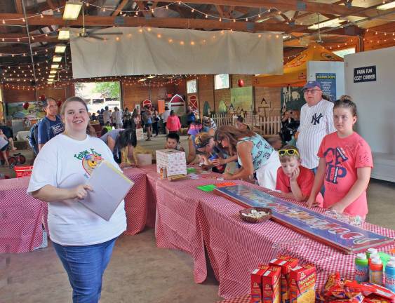 Katie Pascale (Blairstown) spins the ShopRite wheel for a chance to hopeful fairgoers to win prizes and snacks.