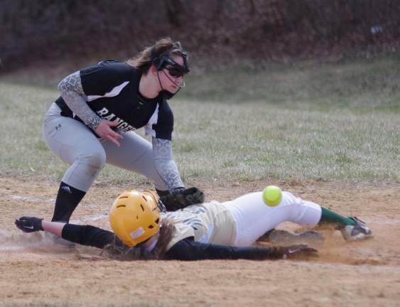 Sussex Tech's Ariana Duran slides safely on home plate after the ball pops loose from the glove of Wallkill Valley's Gabriella Ciasullo.