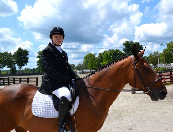Local senior Helene DelleChiaie of Oak Ridge will travel to Cambridge, Mass., on Dec. 6, 2014, to receive her Master Challenge Award (for those riders 60 years of age or older who have the requisite number of scores of 60 percent or higher) from the United States Dressage Federation (USDF) at its Annual Convention Awards Banquet.DelleChiaie earned the scores on her 23-year-old Connemara Pony, Finnian's Chase. Finn and Helene train with Mary Ann Brando of Black Fox Show Stables at the On Course Riding Academy facility in Lafayette.
