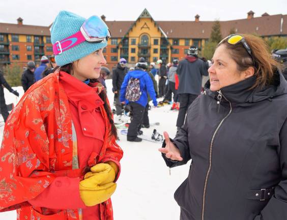 Mountain Creek celebrates Chinese New Year PHOTOS BY VERA OLINSKI Giselle Ioannidis, on right, tells Eva Bonner, on left, how fabulous Chinese New Year is at Mountain Creek.