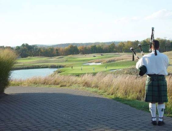 The Ballyowen bagpiper serenades golfers as they complete play in the 2014 Member Appreciation Tournament championship.