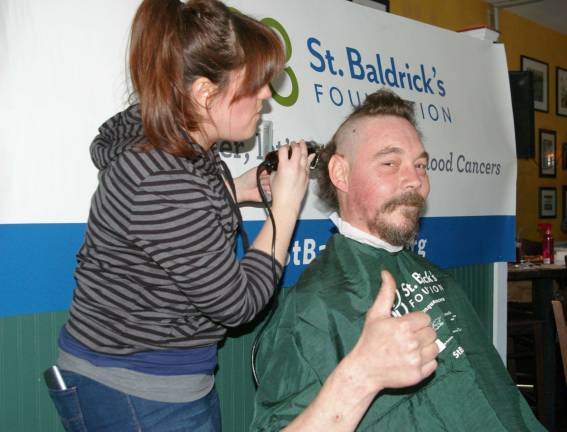 Irish Cottage Inn hosts St. Baldrick's fundraiser Paul Fredette of Vernon gets a þÄúlittle taken off the topþÄù haircutter Maureen Pezzotta of Pro Haircutters of Rockaway.