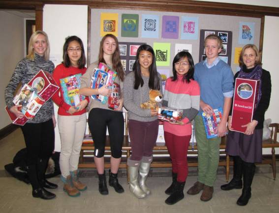 Blair Academy students and faculty display the items gathered by Blair Academy for the Stuff the Stocking contest on behalf of the Season of Hope Toy Drive.