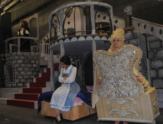 'Beauty and the Beast' at WVRHS The Beast (Albert Weitz) eavesdrops on Belle (Mary Adams) discussing him with Madame de Le Grand Bouche (Ali Castelucci).
