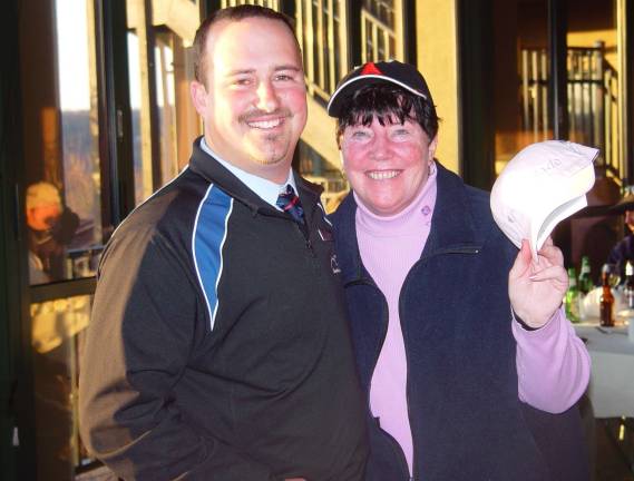 Photo by John T. Whiting The lady&#x2019;s closest to the pin winner Buffy Whiting with Crystal Springs Event Coordinator Tom Dyer