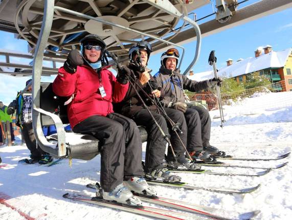 Buffy Whiting gives a thumbs up as she and husband, John, and friend Bob Hoffman enjoy being first chair for the season.