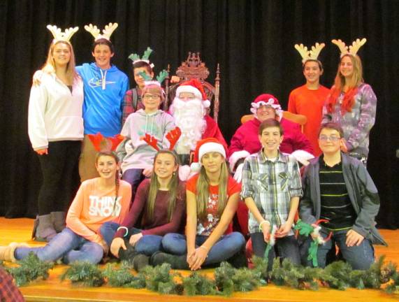 Santa and Mrs. Claus appears with Lafayette Township school students.