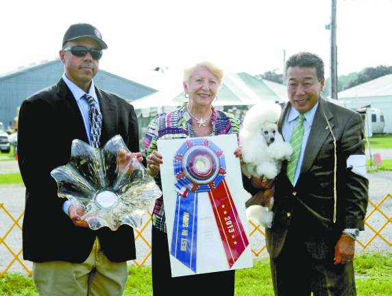 Newton Kennel Club celebrates 75 doggone years Pictured from left: Assemblyman Parker Space, Judge Joan Scott, Toy Poodle GCH Smash JP Sakura owned by Ron Scott and Debbie Burke. The poodle won Best in Show during the club's most recent Labor Day dog show.